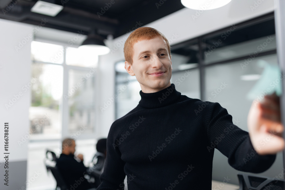 Redhead Male Professional Collaborating in Modern Office Environment Redhead Male Professional Collaborating in Modern Office Environment