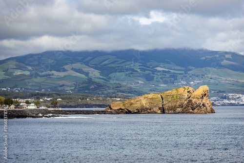 San Roque cliff in the ocean in Sao Roque town Azores San Miguel island Portugal photo