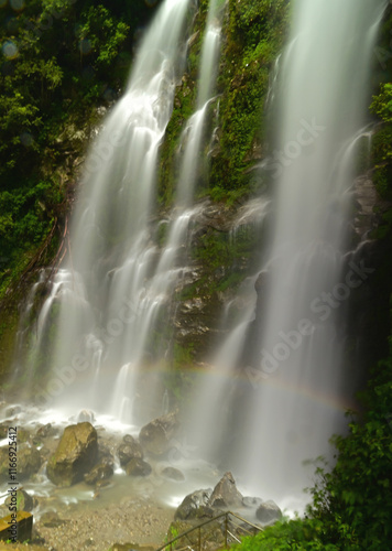 waterfall in the jungle with rainbow