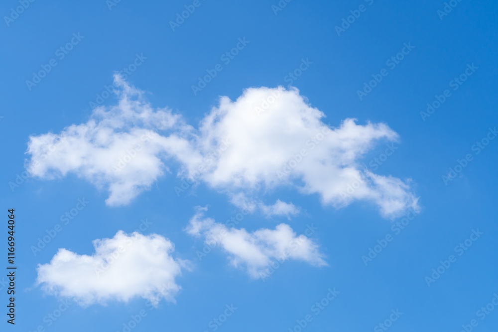 Low angle view of beautiful blue sky with strange shape of clouds in the morning or evening in sunny day used as natural background texture in decorative art work. Low angle view of beautiful blue sky with strange shape of clouds in the morning or evening in sunny day used as natural background texture in decorative art work.