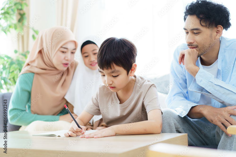 Asian muslim family relaxing in living room together. Asian muslim family relaxing in living room together.