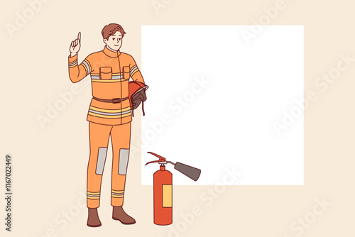 Man firefighter stands near fire extinguisher and copy of space for safety advice. Young guy firefighter from 911 service recommends being careful with electrical equipment and flammable materials