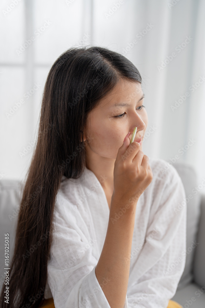 Daily beauty routine Asian woman self care doing gua sha facial massage Traditional medicine Gua Sha quartz stone Cosmetic natural trend. Daily beauty routine Asian woman self care doing gua sha facial massage Traditional medicine Gua Sha quartz stone Cosmetic natural trend.