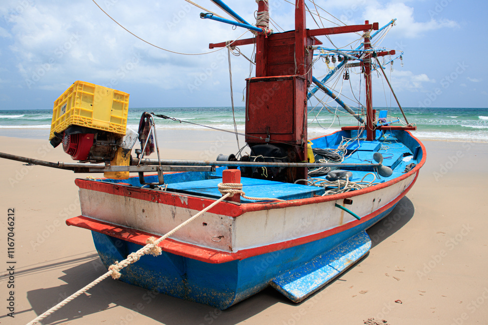 A fishing boat is moored at Tham Thong Beach, Pathio District, Chumphon Province.