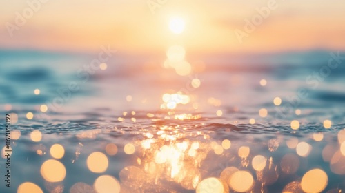 Fototapeta Naklejka Na Ścianę i Meble -  Golden sun descends towards the horizon, reflected on rippling waves, creating a serene atmosphere filled with sparkling lights