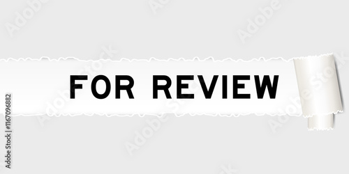 Ripped gray paper background that have word for review under torn part