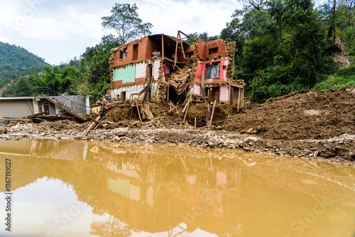 Salamdo River Flooding Damaged Homes in Patikharka of Kavrepalanchok District, Nepal. photo