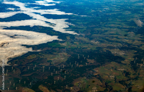 Aerial view of wind turbines and landscape with fog in Germany