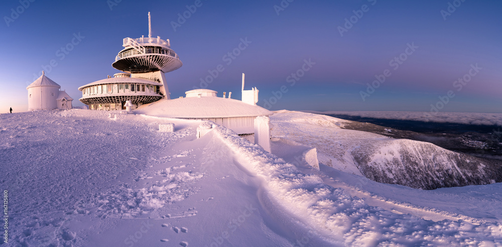 panoramic view on summit of Snezka mountain in Krkonose during winter sunrise in Poland