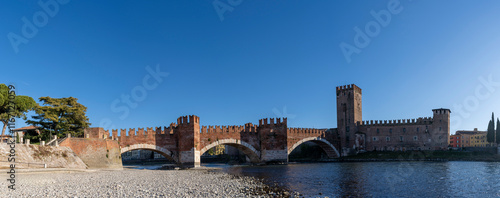 panorama of medieval scaligero castelvecchio bridge over adige river, verona, italy - world travel concept photo