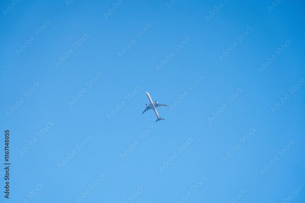Flying aeroplane over the blue sky Flying aeroplane over the blue sky