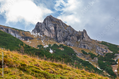 Autumn Forest in the Rofan Mountains, Tyrol, Austria, with Golden Larch Trees and Rocky Peaks