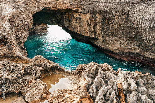 Arched rock formation over the sea at Cala s'Almonia. Mallorca, Balearic Islands, Spain.