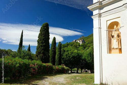 Old church and lenticular cloud  over San Nicolao village.  Corsica island photo