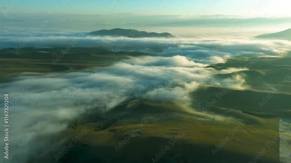 Spectacular sunrise over rolling hills with mist in breathtaking landscape Spectacular sunrise over rolling hills with mist in breathtaking landscape
