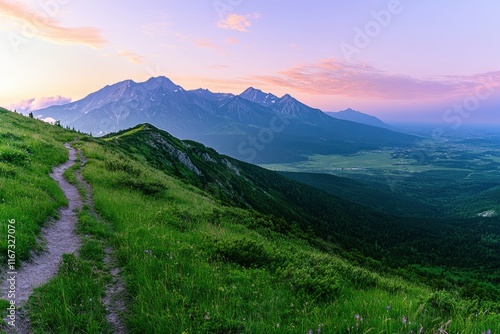 Photo of a green, grassy hill with a mountain path at sunset in the Tatra Mountains, Poland. North-east central Europe top of a high peak overlooking a beautiful valley and mountains during a summer