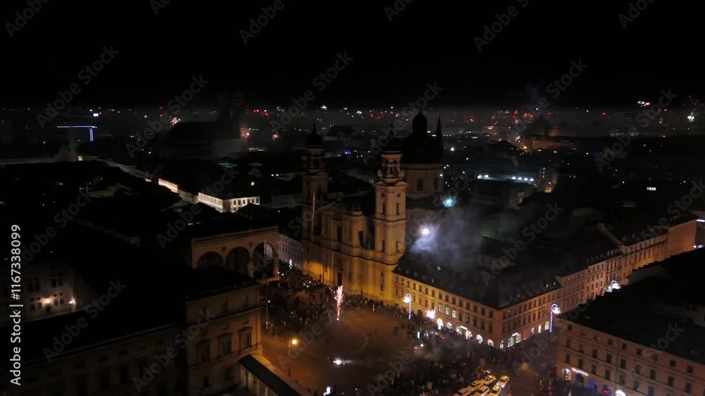 Aerial view at midnight of fireworks rockets and firecrackers in downtown Munich, Germany at Odeonplatz. Feldherrnhalle and Theatinerkirche in salute. Silvester Feuerwerk uber Munchen Luftaufnahme. Aerial view at midnight of fireworks rockets and firecrackers in downtown Munich, Germany at Odeonplatz. Feldherrnhalle and Theatinerkirche in salute. Silvester Feuerwerk uber Munchen Luftaufnahme.
