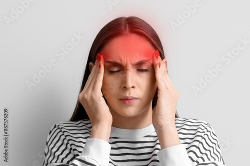 Young woman feeling pain in...
