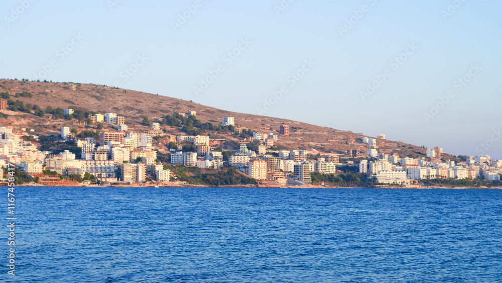 Stunning Albanian sunset over the sea, with Sarande seaside views. Stunning Albanian sunset over the sea, with Sarande seaside views.