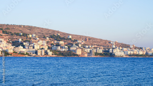 Stunning Albanian sunset over the sea, with Sarande seaside views.