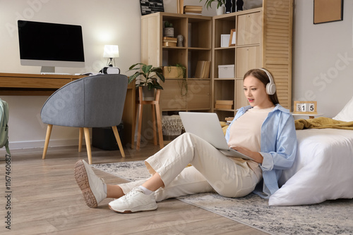 Young woman with headphones...