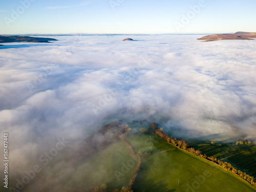 Aerial shot of fog blanketing rural farmland in Wales photo