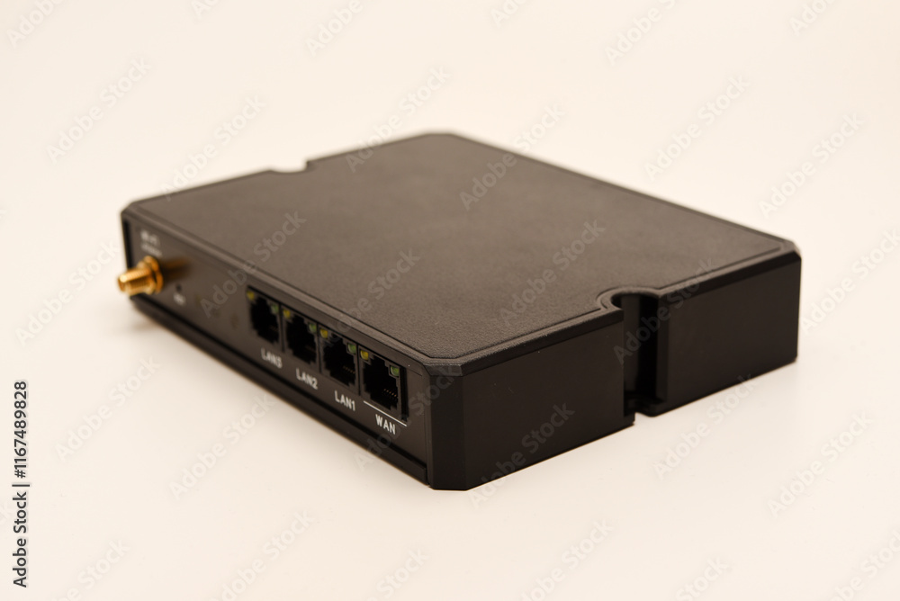 GSM modem. An Internet station with a SIM card. A black router on a white background. GSM modem. An Internet station with a SIM card. A black router on a white background.