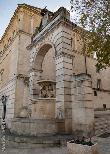 Ferdinandea fountain enhancing matera's historical charm at sunset photo