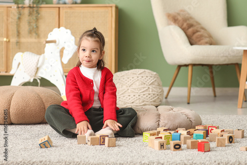Cute little girl with woode...