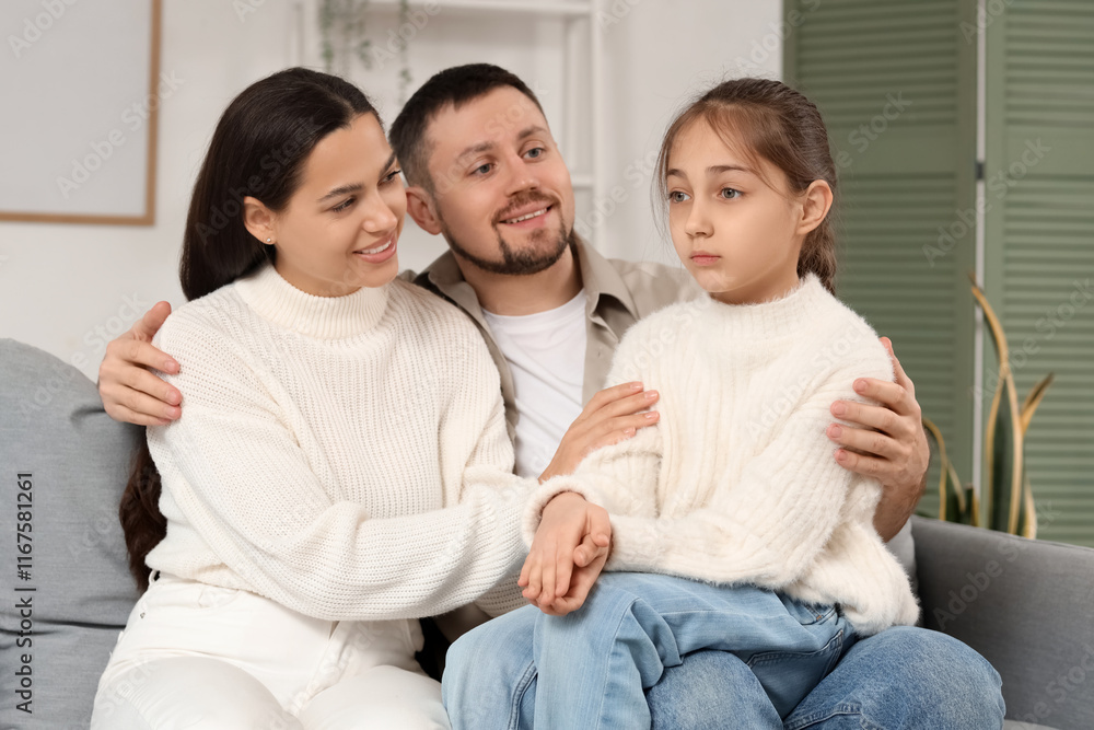 Parents apologizing to their daughter on sofa at home Parents apologizing to their daughter on sofa at home