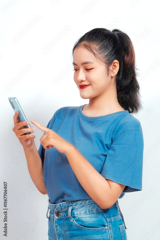 Smiling young Asian woman employee holding her phone, isolated by white background Smiling young Asian woman employee holding her phone, isolated by white background