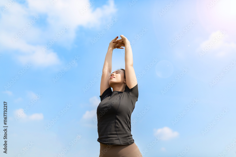 Fitness young woman doing stretch exercise stretching her arms Fitness young woman doing stretch exercise stretching her arms