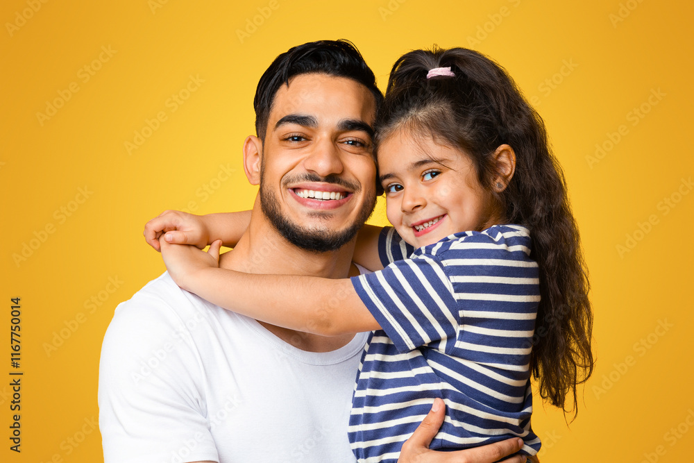 Portrait Of Happy Young Arab Dad Holding His Little Daughter On Hands, Loving Middle Eastern Dad Bonding With Cute Female Child While They Posing Together Over Yellow Studio Background, Copy Space Portrait Of Happy Young Arab Dad Holding His Little Daughter On Hands, Loving Middle Eastern Dad Bonding With Cute Female Child While They Posing Together Over Yellow Studio Background, Copy Space