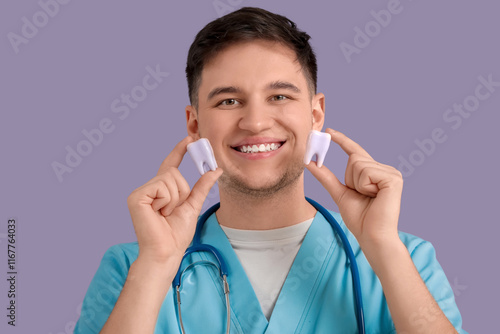 Young happy male dentist to...
