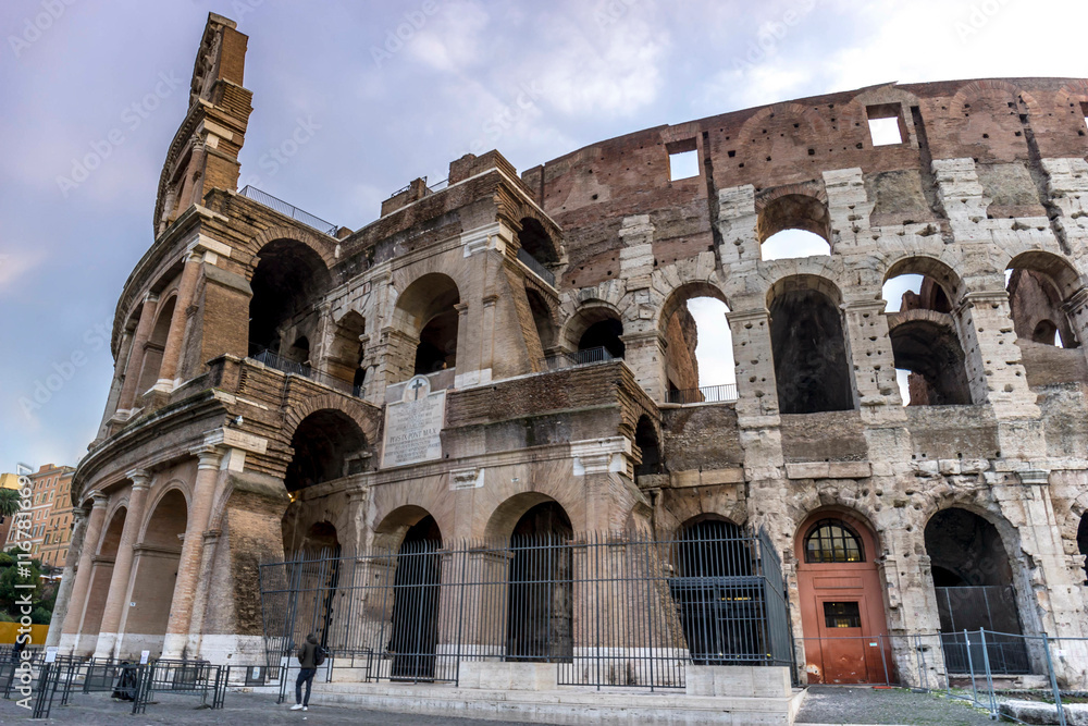 Fototapeta premium Colosseum morning in Rome, Italy. Exterior of the Rome Colosseum. Architecture and landmark of Rome and Italy.