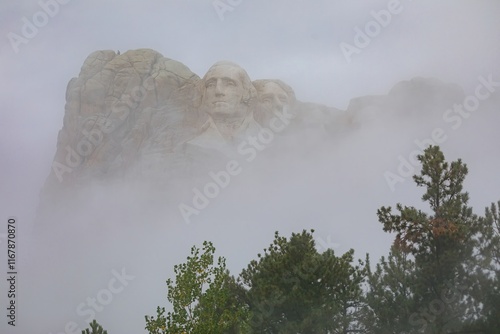 Misty Mount Rushmore. Fog shrouds the presidents' faces carved into the granite mountain. Mount Rushmore National Memorial, Keystone, South Dakota, USA. photo