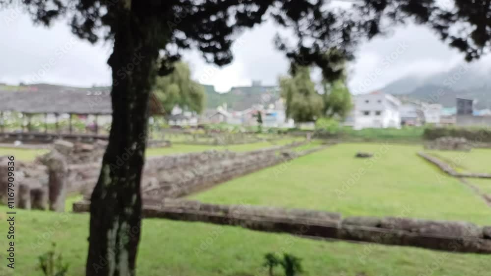 blur of ancient temple yard surrounded by rocks, trees and green grass shrouded in mist from the background concept of ruined temple and hill, out of focus, abstract blur of ancient temple yard surrounded by rocks, trees and green grass shrouded in mist from the background concept of ruined temple and hill, out of focus, abstract