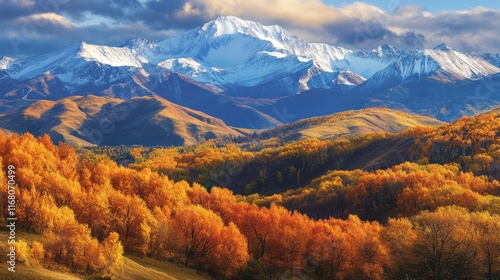 The Ushiro-Tateyama range in autumn, with fiery foliage carpeting the lower slopes and Mt. Shirouma's snow-capped peak gleaming in the distance photo