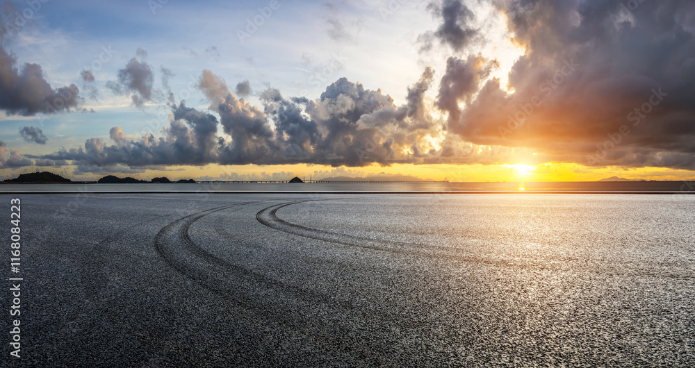 Asphalt road square and beautiful coastline with sky clouds nature landscape at sunset in Zhuhai, China. Outdoor asphalt parking lot.