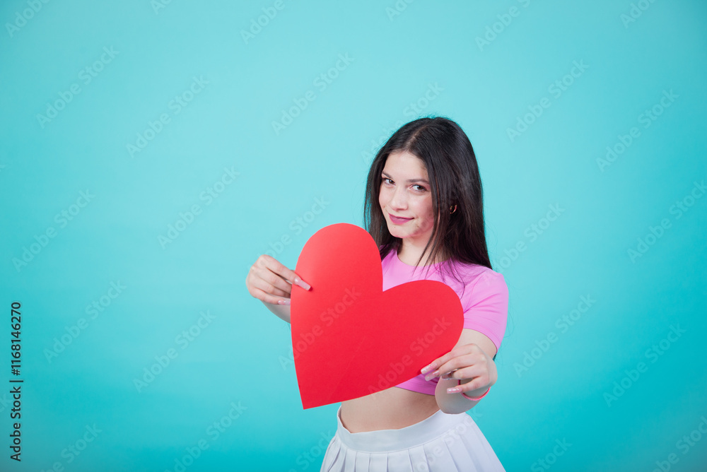Smiling Woman Holding a Large Red Heart for Valentine's Day Smiling Woman Holding a Large Red Heart for Valentine's Day