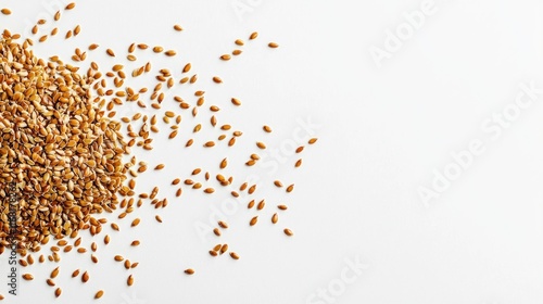 Brown flax seeds scattered on white background