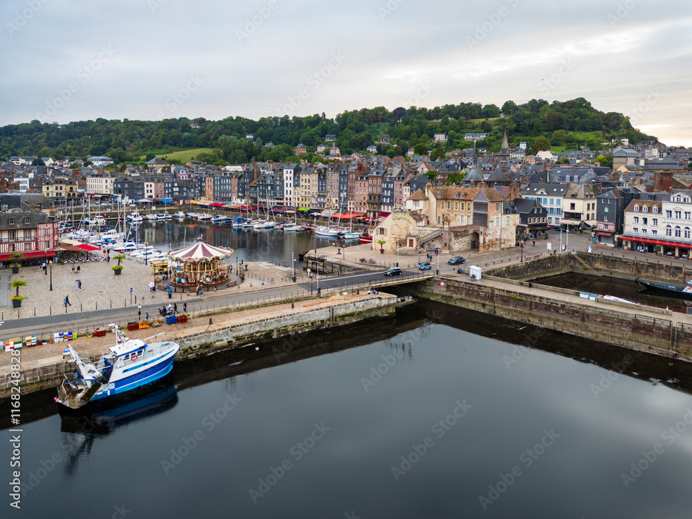 A charming harbor lined with sailboats surrounded by historic buildings in a picturesque port town Honfleur, France