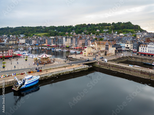 Obraz na płótnie A charming harbor lined with sailboats surrounded by historic buildings in a picturesque port town Honfleur, France w salonie