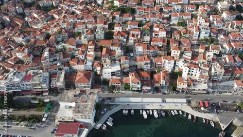 Aerial view of Plomari town traditional houses, fishing port with boats, Lesbos island photo