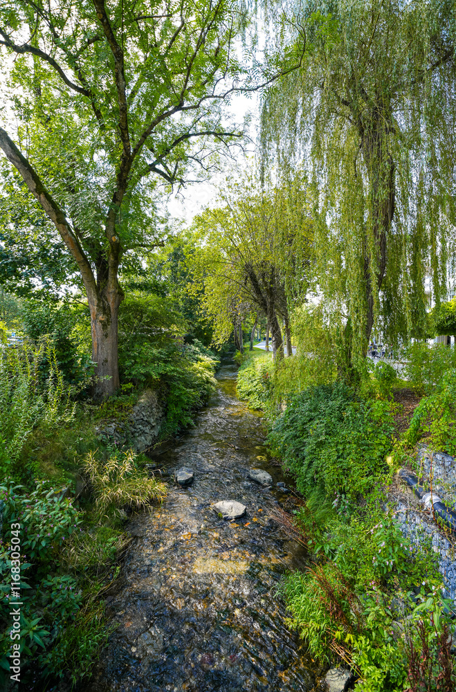 Park with a stream in the city center of Olsberg with the surrounding nature. Park with a stream in the city center of Olsberg with the surrounding nature.