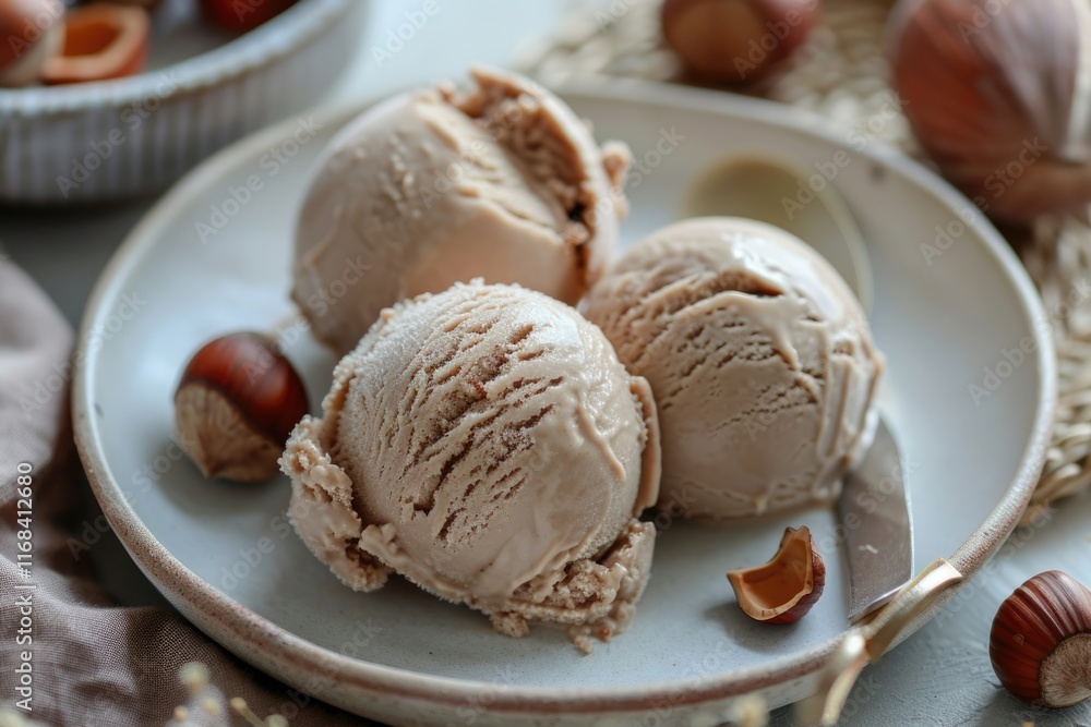 Fresh hazelnut ice cream on plate close up Fresh hazelnut ice cream on plate close up