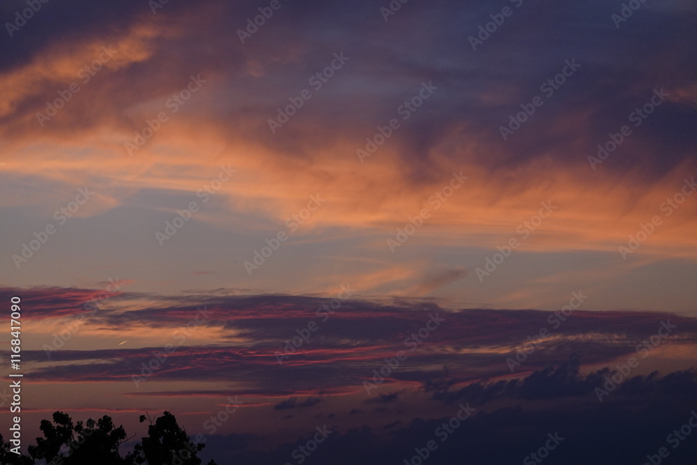 Naklejka premium Rose sunset and colorful clouds