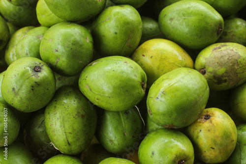 green background of kedondong fruit (Spondias dulcis) photo