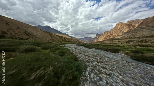 Mountain river flowing through a rocky desert valley