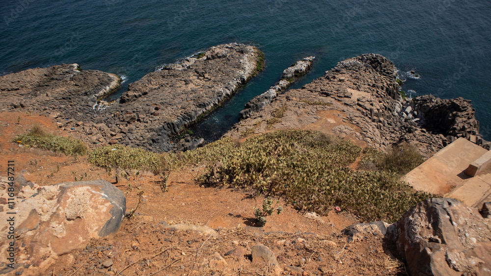 Beach made of rock and stones at the island of Goree, slave export island close to Dakar, Senegal..